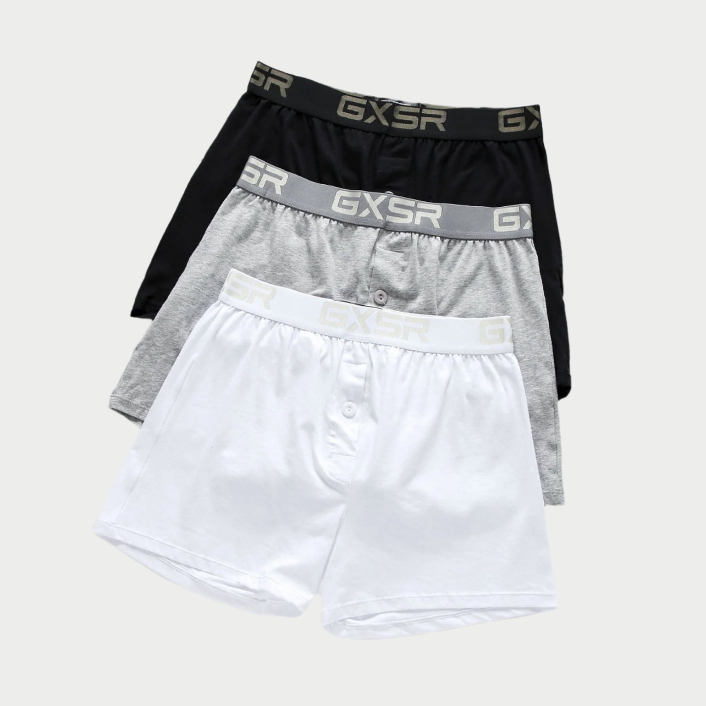 Three pairs of men's underwear in black, gray, and white with GXSR branding on a light gray background.