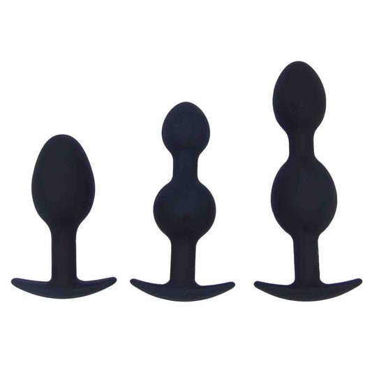 Three black silicone butt plugs in different sizes, each with a smooth, rounded design.