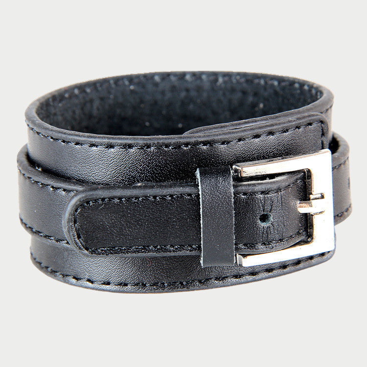 Black leather bracelet with a silver buckle on a white background