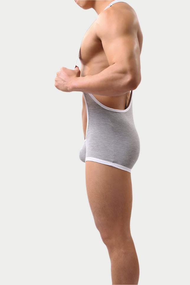 Person wearing a gray underwear set on a white background