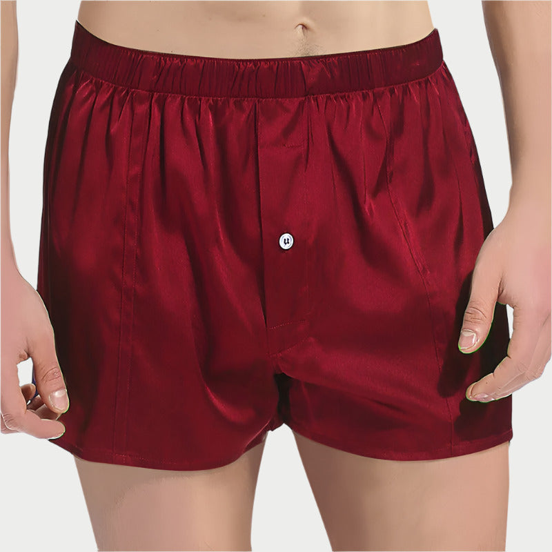 This image displays a pair of Mulberry Pure Silk Boxers, characterized by their sleek black color. The boxers are crafted from high-quality 100% Mulberry Silk, offering a luxurious softness and breathability that enhances comfort and soothes the skin.