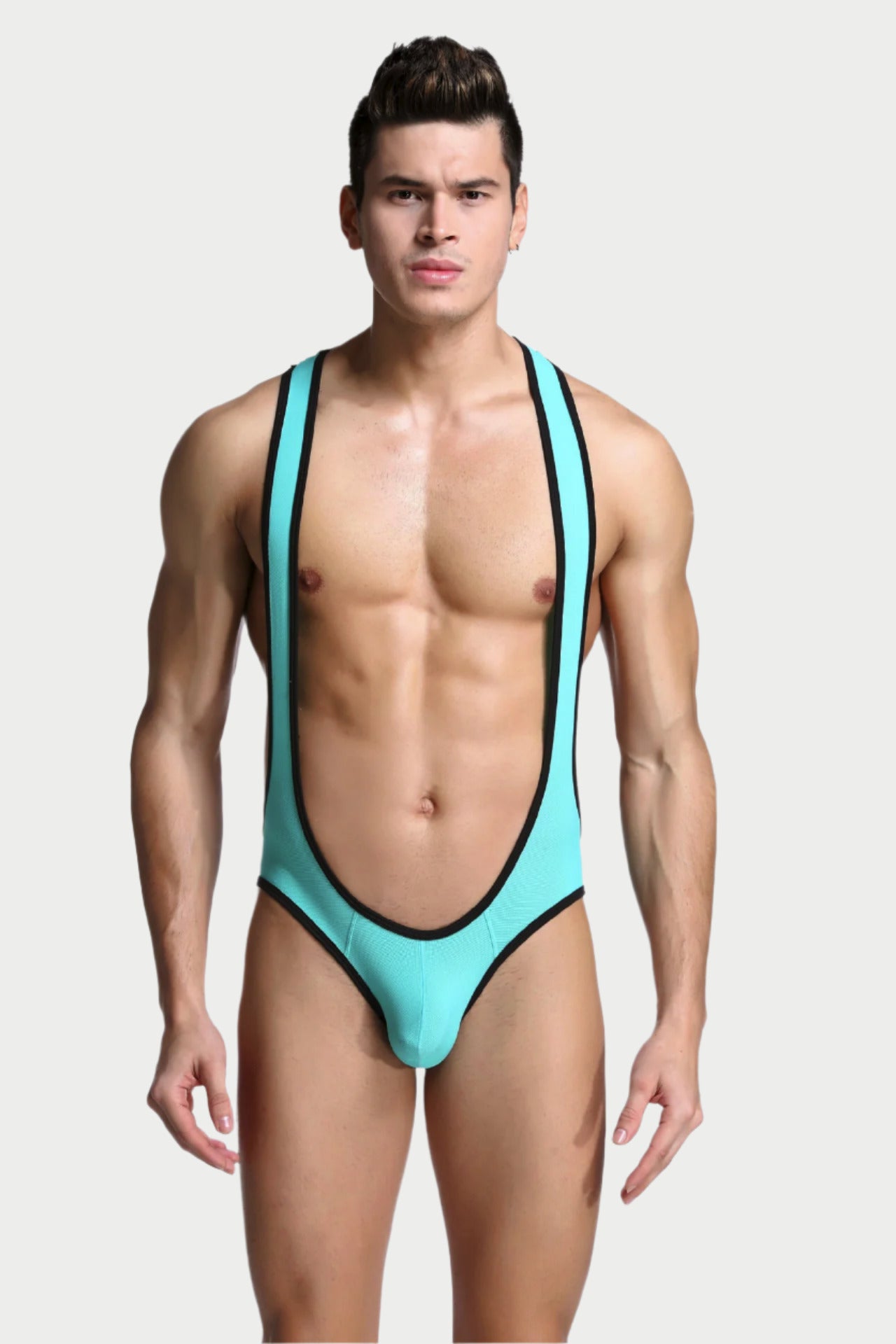 Man wearing a turquoise swimsuit with black trim on a white background