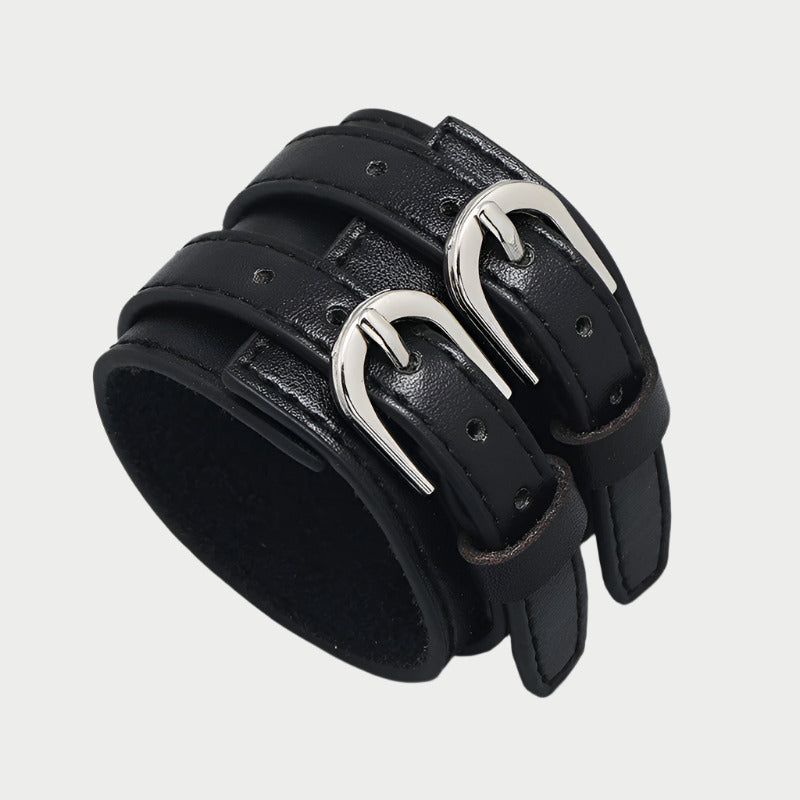 Adjustable black faux leather bracelet with two silver buckles.