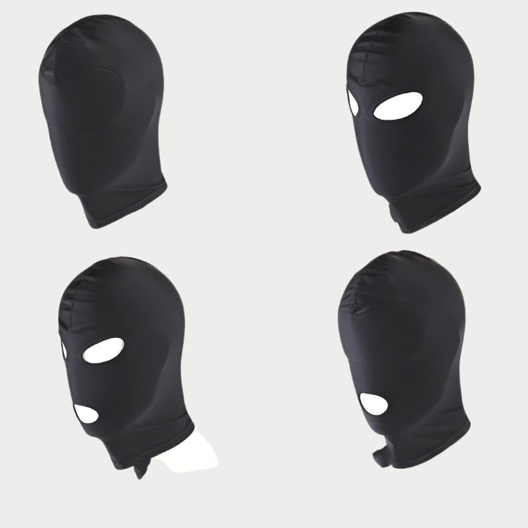 Four black balaclavas with eye holes on a white background