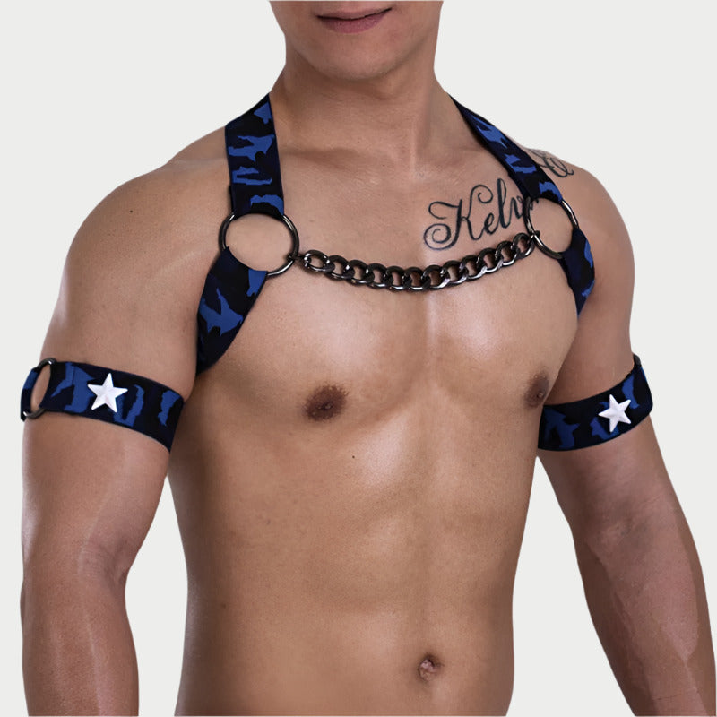 Person wearing a black and blue harness with star patterns on a plain background