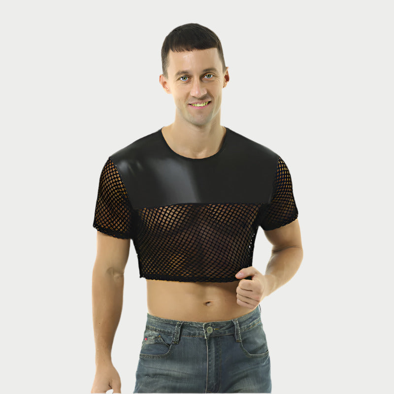 Man wearing a black mesh top and jeans on a white background