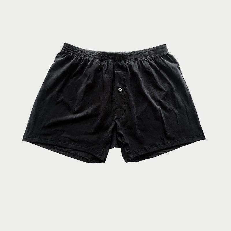 Black boxer shorts on a light gray background