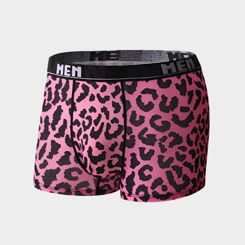 Pink boxer briefs with black leopard print pattern on a white background