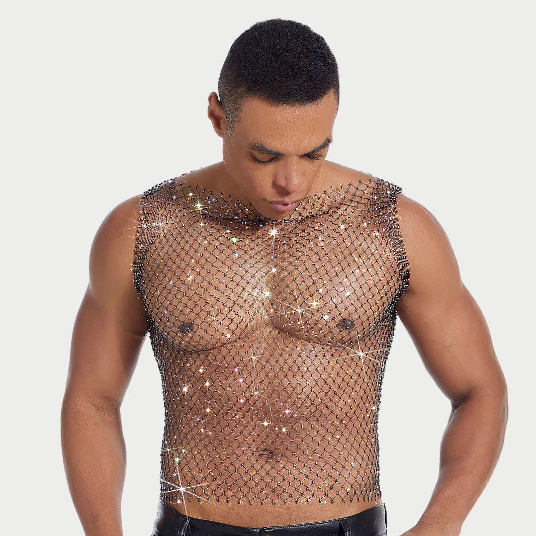 Man wearing a sparkling fishnet top against a plain background