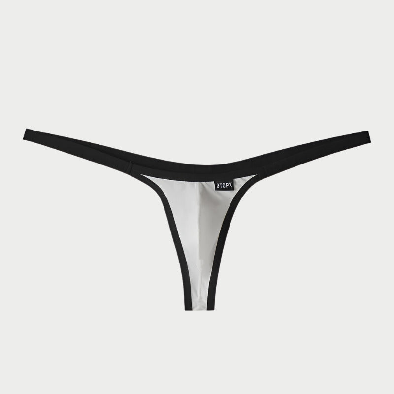 A black and white nylon thong underwear for men, with a visible brand label.