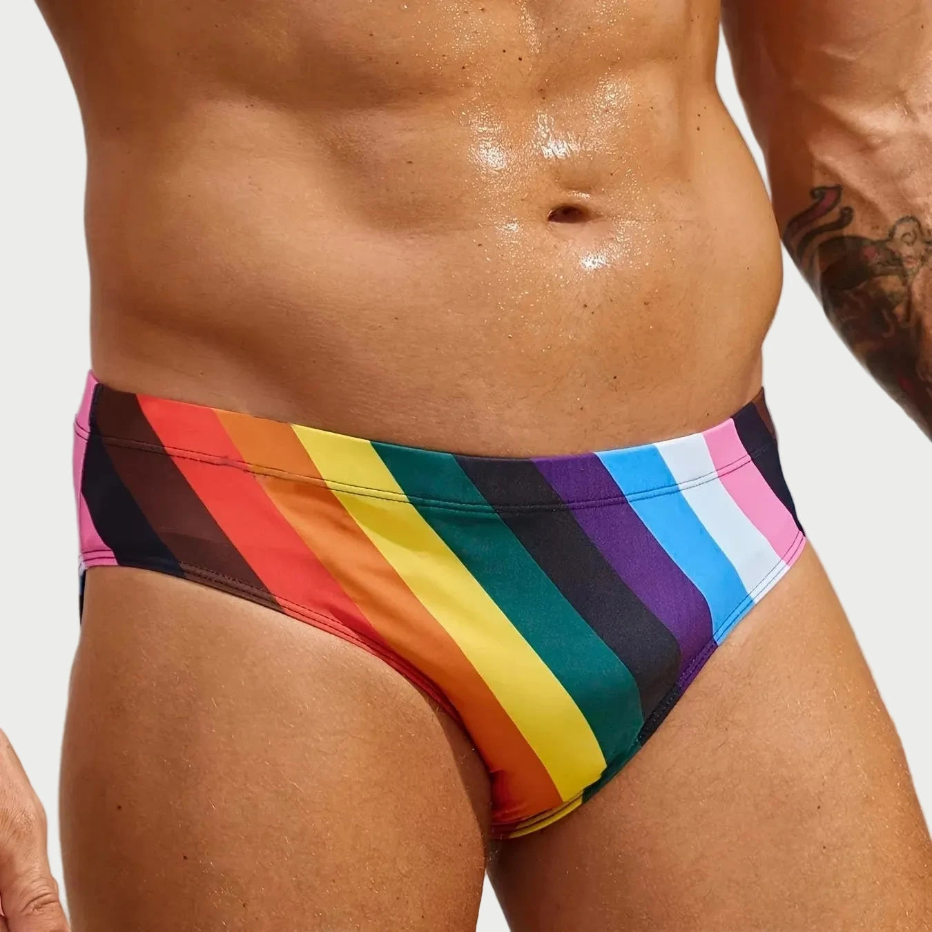 Person wearing a colorful rainbow striped swimsuit