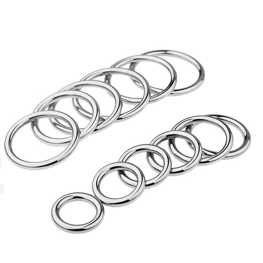 A set of shiny, silver stainless steel cock rings displayed in two rows, with each ring featuring a smooth and polished finish.