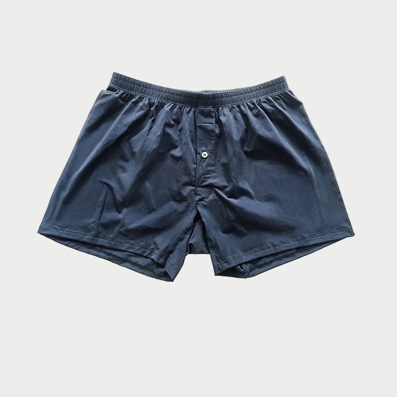 Navy blue boxer shorts on a light gray background