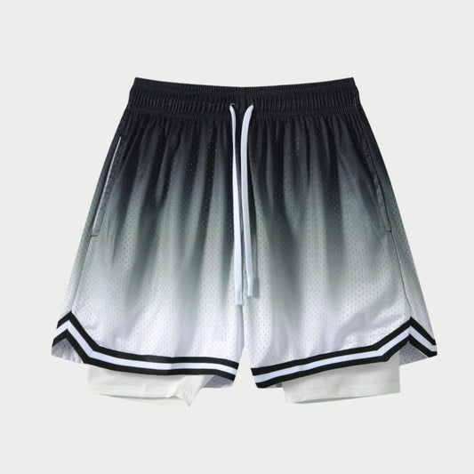 A pair of athletic shorts with a gradient fade design from black to white, with a drawstring waistband and black trim around the legs.