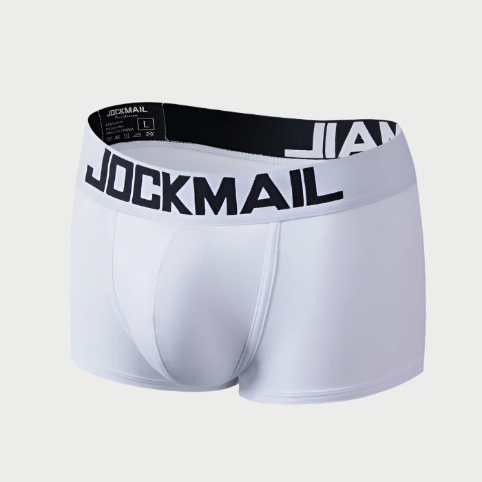 White boxer briefs with black waistband featuring 'Jockmail' branding on a white background.