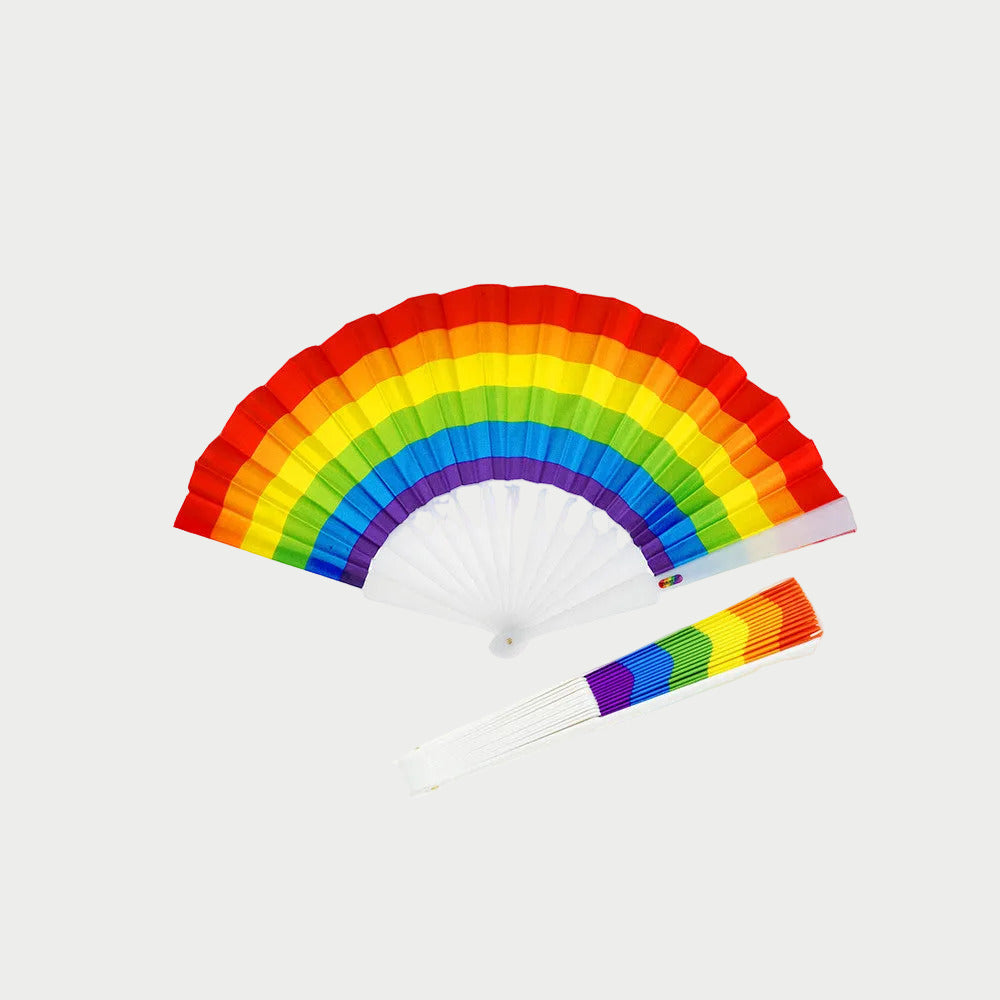 Rainbow-colored hand fan with matching headband on a white background