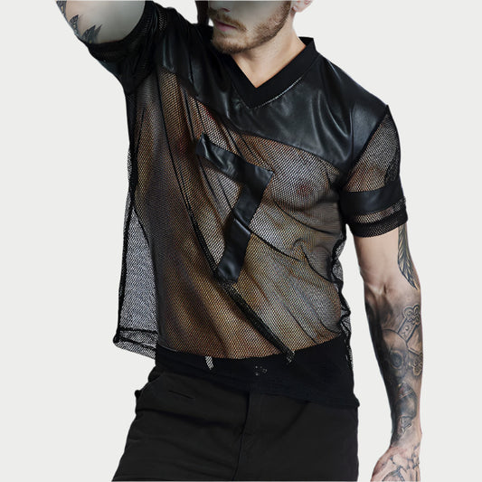Person wearing a black mesh shirt with leather accents on a plain background