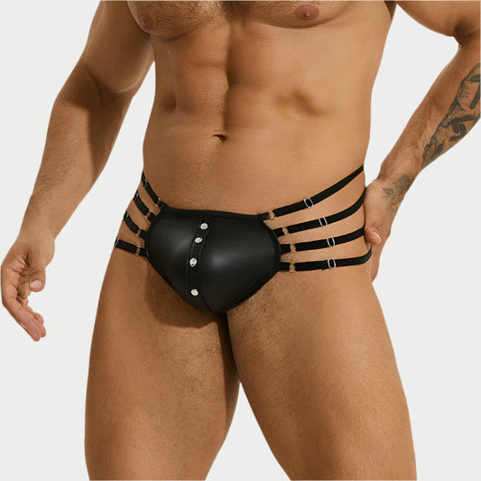 Black garter belt with straps worn by a person on a white background