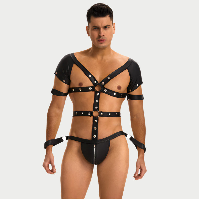 Man wearing a black leather harness on a white background
