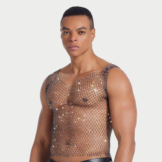 Person wearing a sparkling mesh top against a plain background