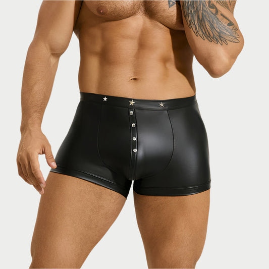 Black leather-style underwear worn by a person on a white background