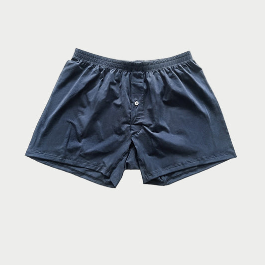 Navy blue boxer shorts on a light gray background