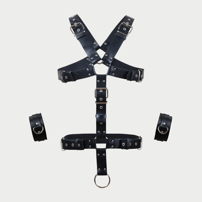 Black leather harness with multiple straps on a white background