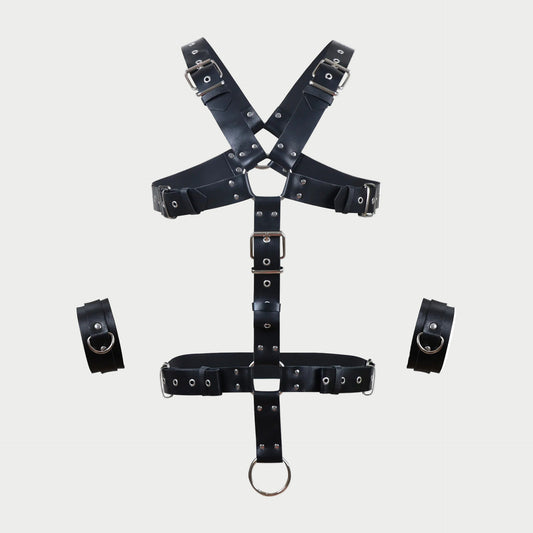 Black leather harness with multiple straps on a white background